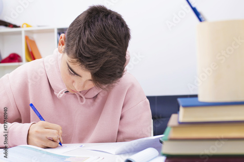 child studying at home or school desk