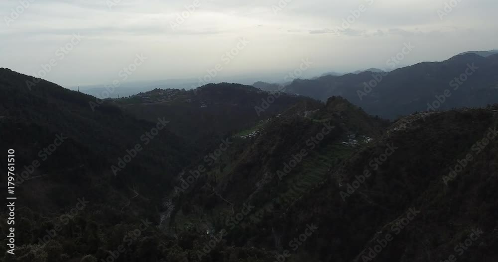 Flying over dark green mountaintops Flying over dark green mountaintops