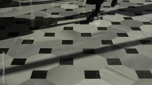 Feet Running Across Marble Floor