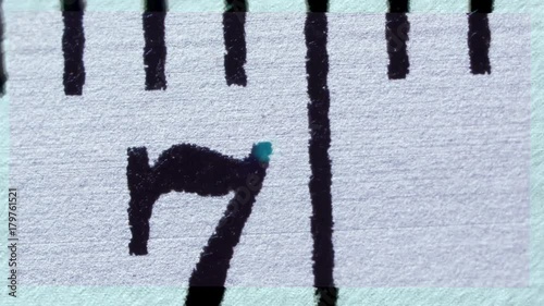 Zoom out, close up of ruler