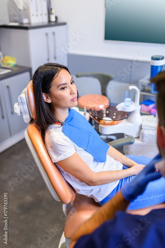 A female patient waiting for treatment in a dental studio