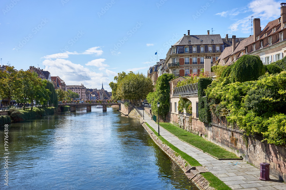 River of Strasbourg in Alsace, France / Traditional colorful houses at river in La Petite France 