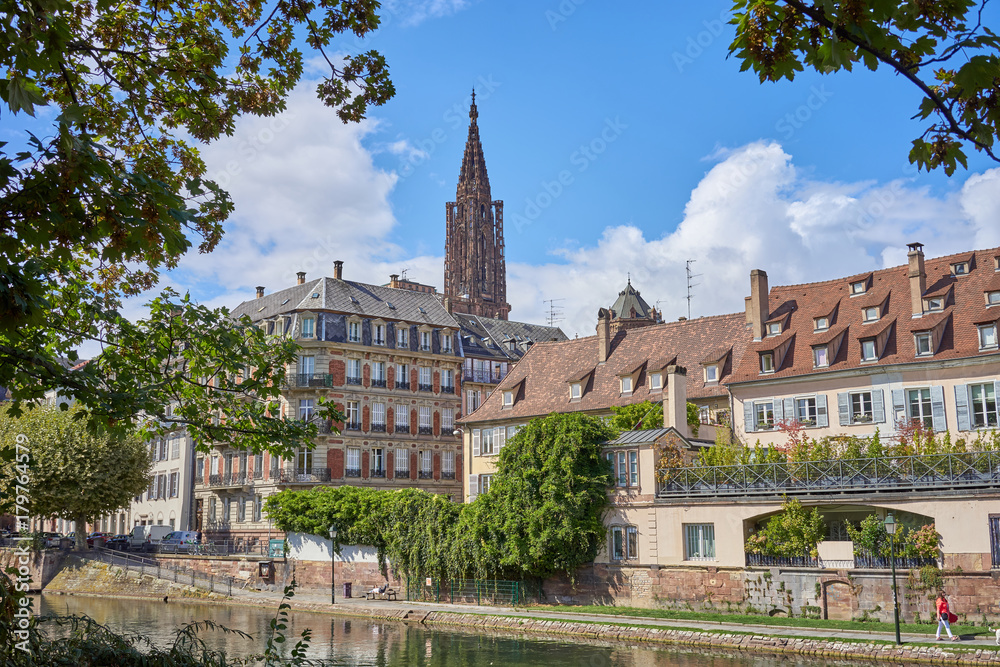 Fototapeta premium River of Strasbourg in Alsace, France / Traditional colorful houses at river in La Petite France 