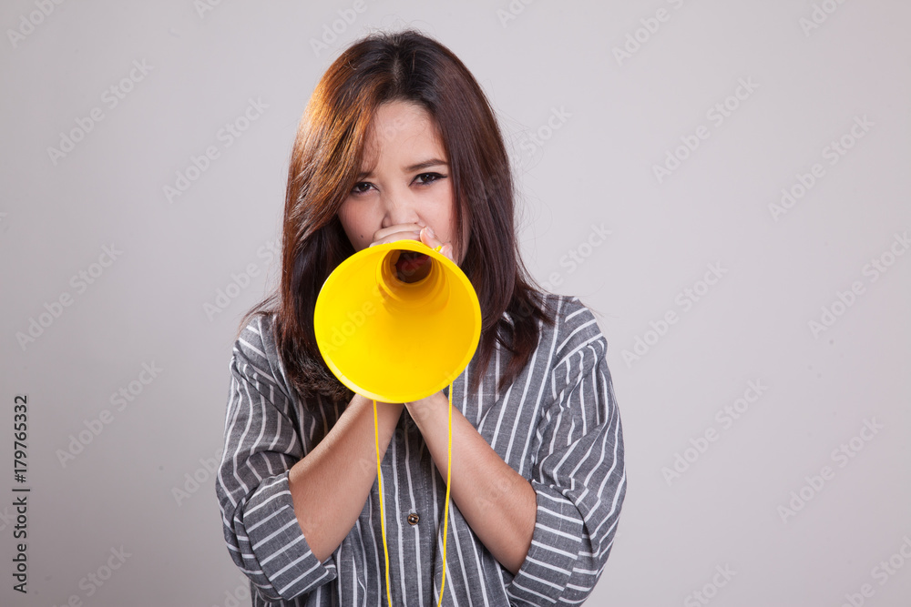 Beautiful young Asian woman announce with megaphone. Beautiful young Asian woman announce with megaphone.
