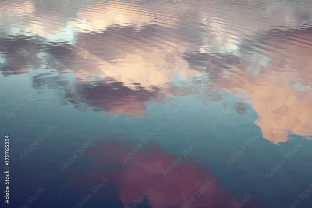 reflection of blue sky with white clouds in water, abstract background. - obrazy, fototapety, plakaty 
