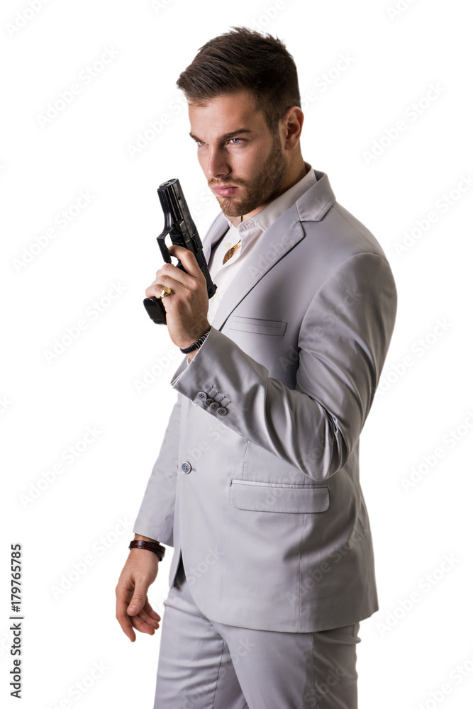 Elegant man with gun, dressed as a spy or secret agent, isolated on white Elegant man with gun, dressed as a spy or secret agent, isolated on white