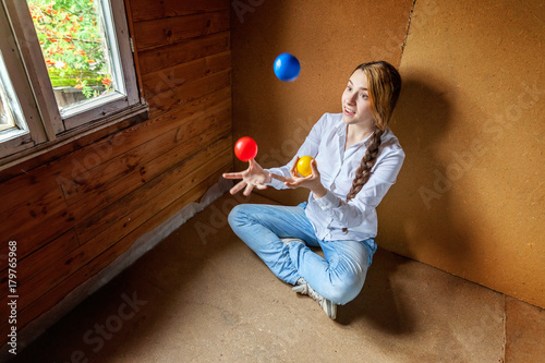 young woman juggling