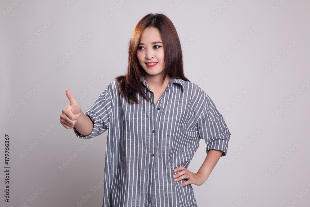 Asian woman thumbs up and smile. Asian woman thumbs up and smile.