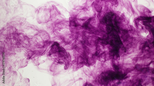 Purple smoke ink in front of white background