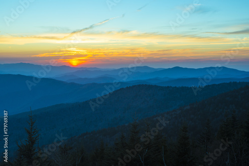 Spectacular Sunset in Smoky Mountains with Blue Ridge hills layered to the horizon with orange red sky