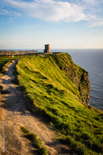 cliffs of moher in the evening with O’Brien’s Tower