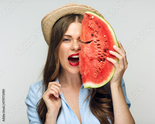 Close up face portrait of smiling woman holding watermelon.