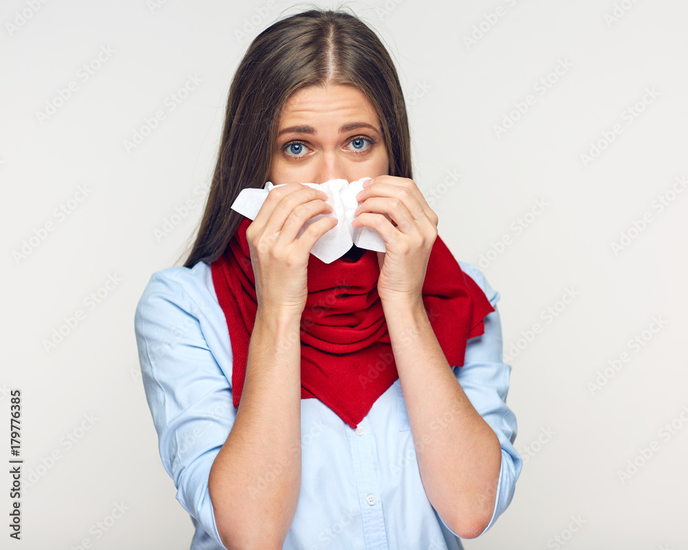 Sickness woman blowing his nose in paper tissue. Sickness woman blowing his nose in paper tissue.