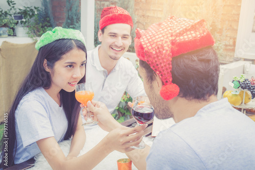 Asian group people man and woman drink and celebration at party outdoor. group of friends social event with beverage on hand with achievement, festive concept.