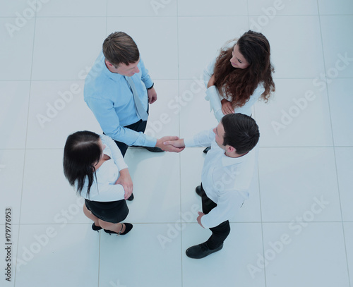 greeting business partners.a handshake at a meeting in the offic photo