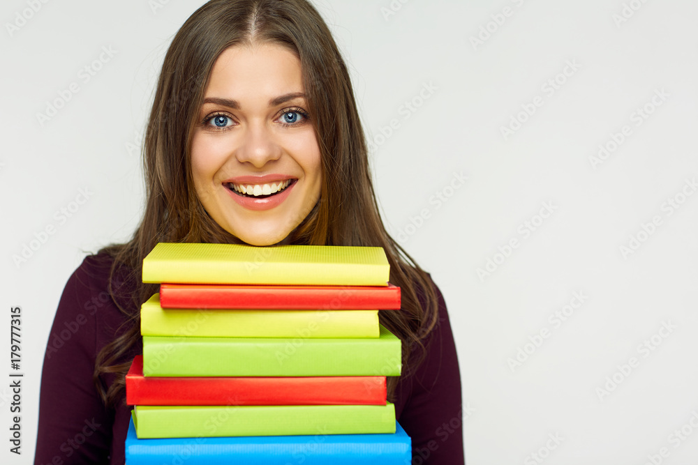 Close up portrait of student girl with books pile. Close up portrait of student girl with books pile.