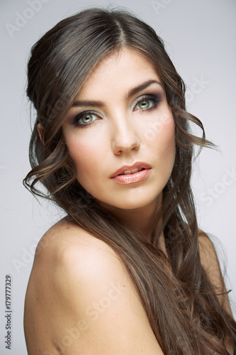 Close up beauty face studio portrait of young female model.