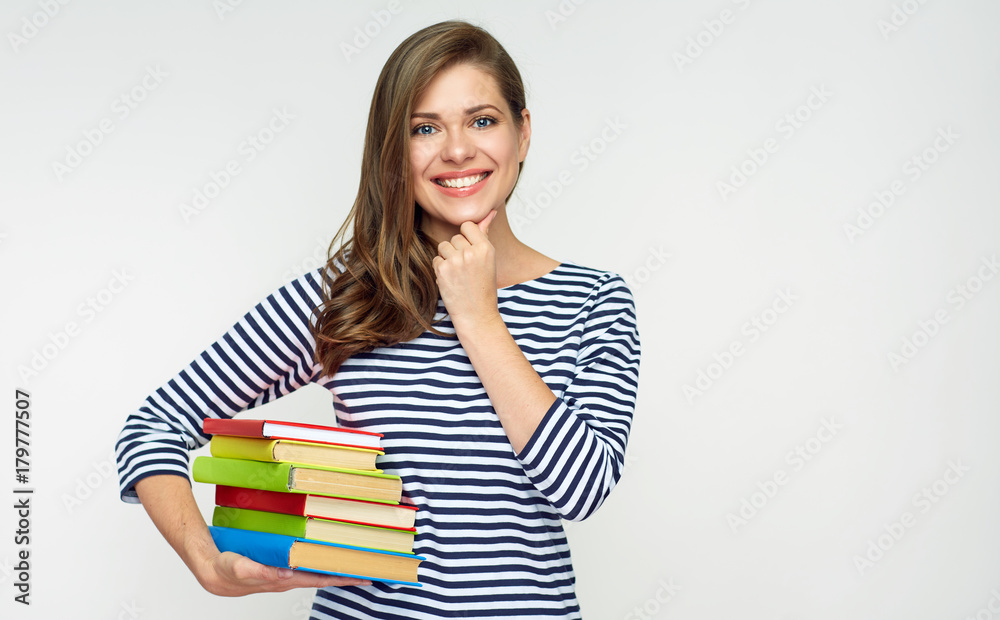Girl student holding pile of books. Girl student holding pile of books.