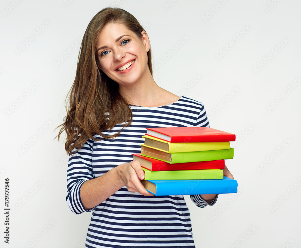 Smiling student girl holding pile of books. Smiling student girl holding pile of books.