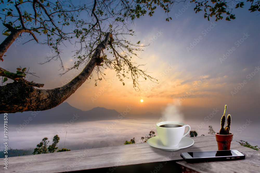 regular hot black coffee tea on the resting of terrace takes with the wonderful morning with cold season of mist flowing in background regular hot black coffee tea on the resting of terrace takes with the wonderful morning with cold season of mist flowing in background