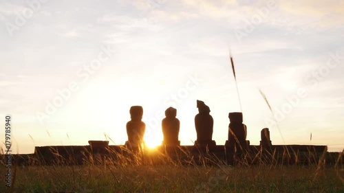 Moais in Ahu Vai Uri at sunset, Tahai Archaeological Complex, Rapa Nui National Park, Easter Island, Chile photo