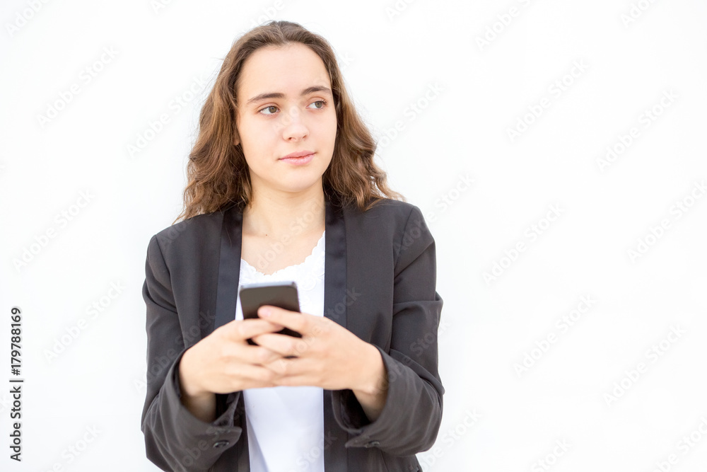 Concentrated female manager thinking of message Concentrated female manager thinking of message