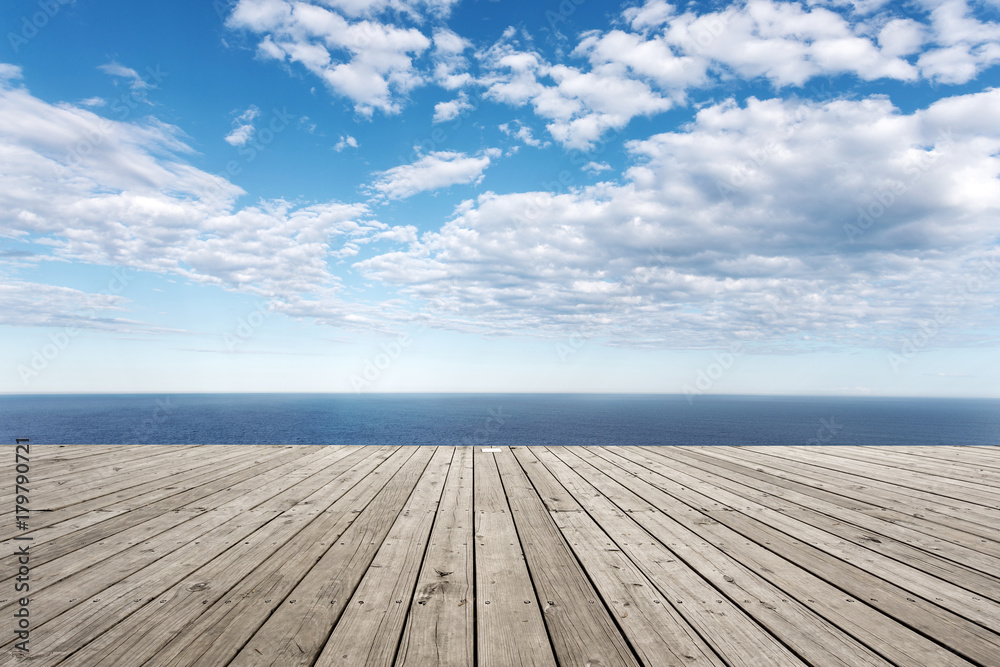 empty wooden floor with beautiful sea in blue cloud sky empty wooden floor with beautiful sea in blue cloud sky