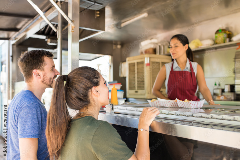 Customers making line in a food truck