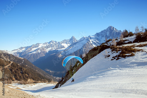 A paraglider takes off in Chamonix valley