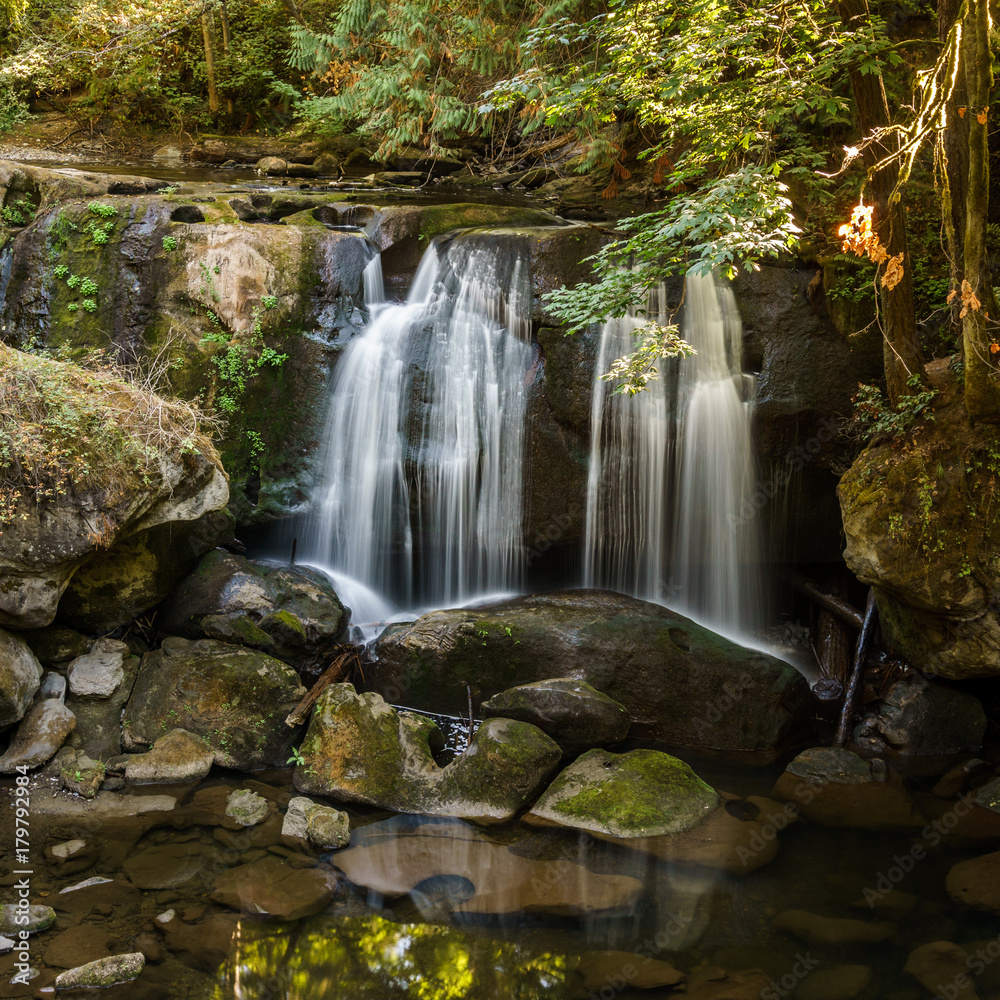 Fototapeta premium Close up mountain waterfall fast rushing water.