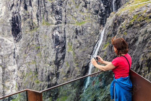 Tourist woman on Trollstigen viewpoint in Norway