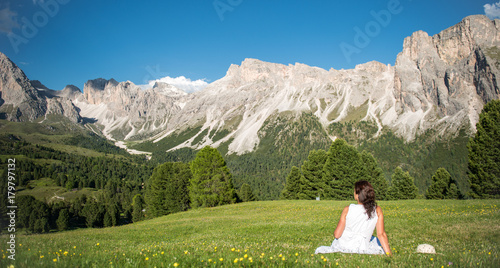 White dressed woman at the Dolomites