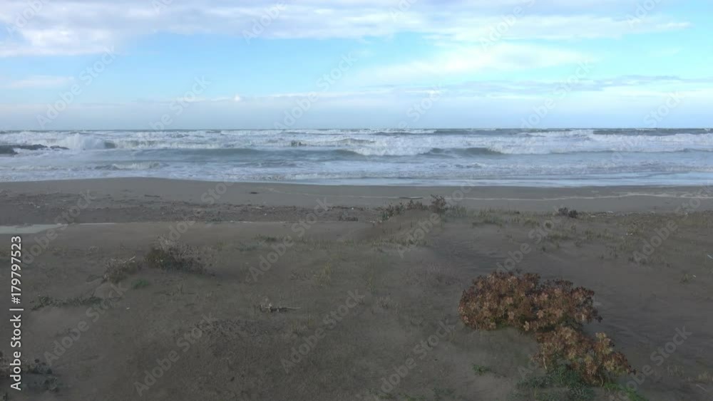 Waves rolling on the beach is a stormy day, winter mediterranean sea. Focene, Lazio, Italy. 4k Waves rolling on the beach is a stormy day, winter mediterranean sea. Focene, Lazio, Italy. 4k