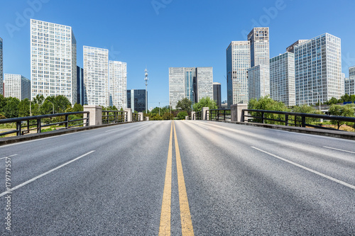 Asphalt road and urban commercial building scenery