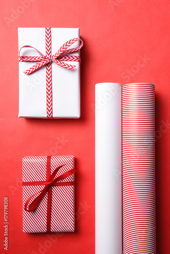 Two Wrapped Christmas presents with matching paper photo