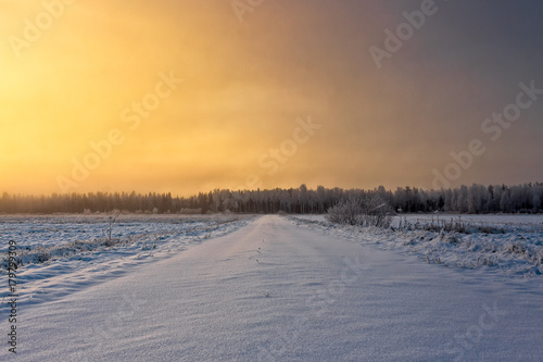 Snowy Road In The Winter Sunrise