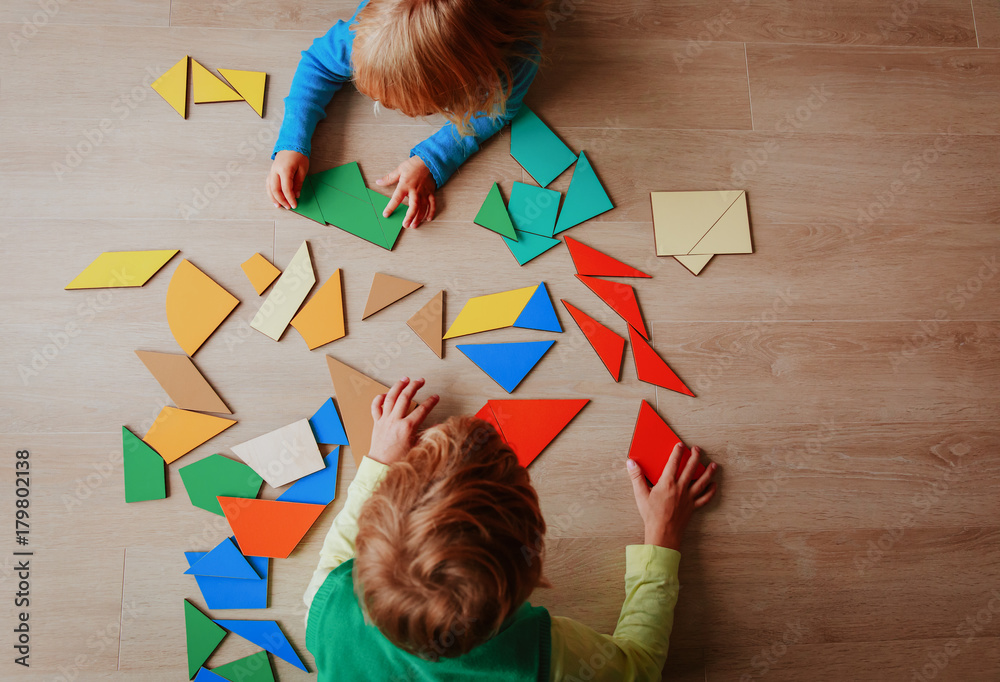 kids playing with puzzle, education concept