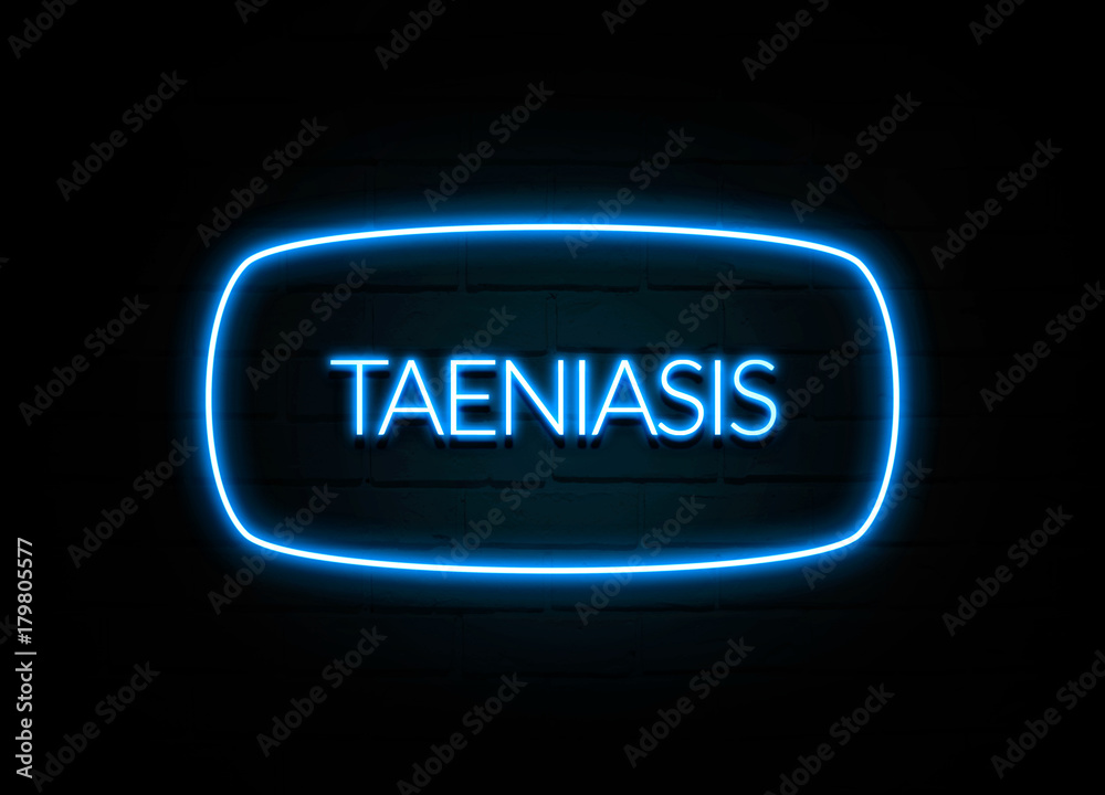Taeniasis - colorful Neon Sign on brickwall Taeniasis - colorful Neon Sign on brickwall