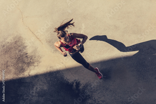 Women running in to the shadow photo