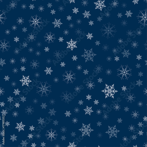 abstract Christmas seamless pattern from white snowflakes on a blue background. For holiday, new year, celebration, party.