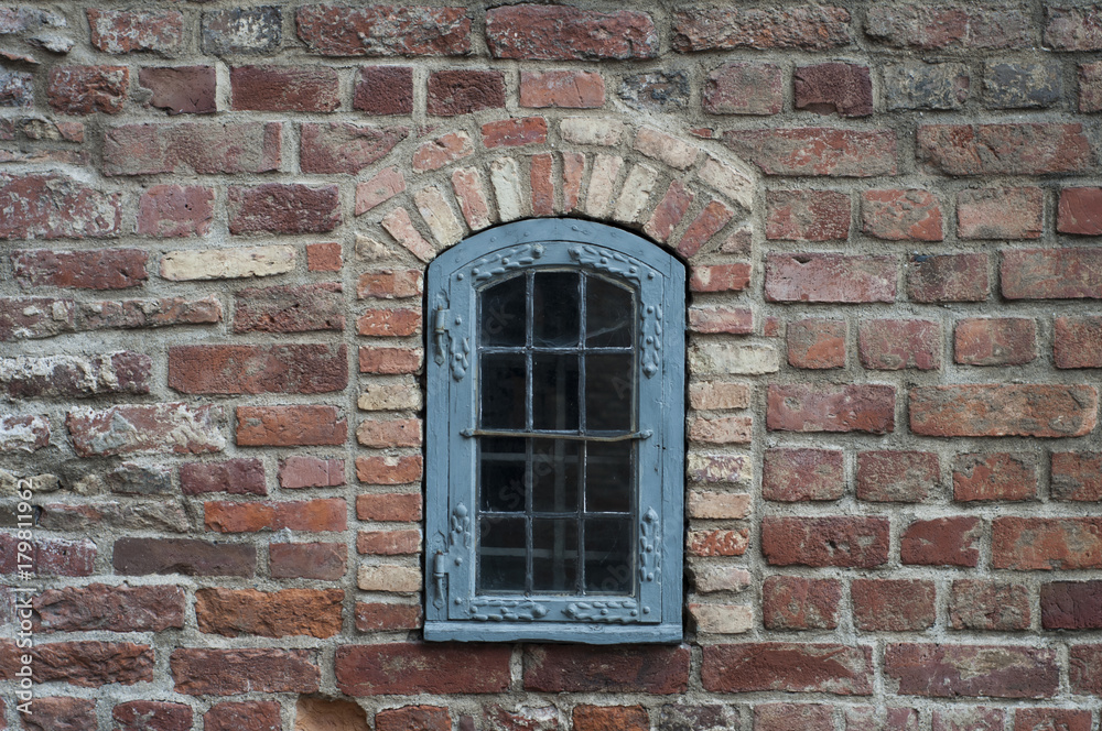 Brick wall with old window
