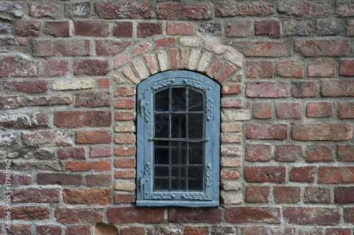 Brick wall with old window 