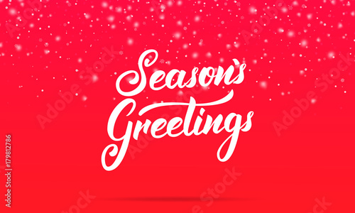 Christmas. Season's Greetings lettering design. Winter holiday card with Season's Greetings calligraphy and shiny glitter snowflakes and snow.