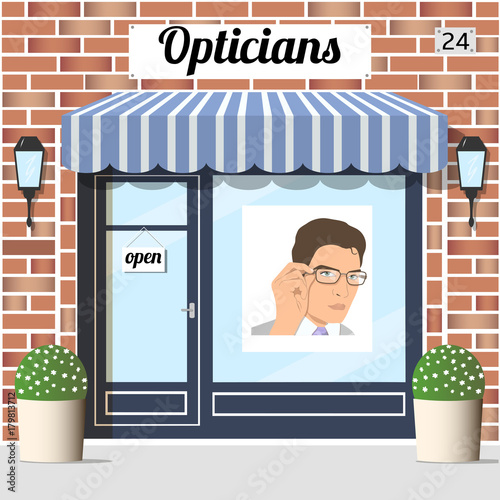 Opticians shop building with red bricks facade.