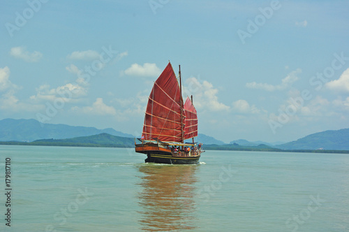 Photography junk sailing boat red sails