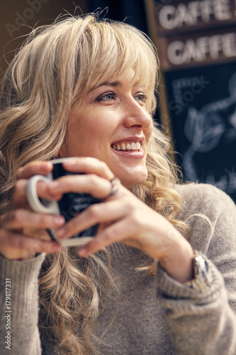 Portrait of a happy woman thinking and looking away