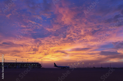 airplan taxiing infront of majestic morning sky