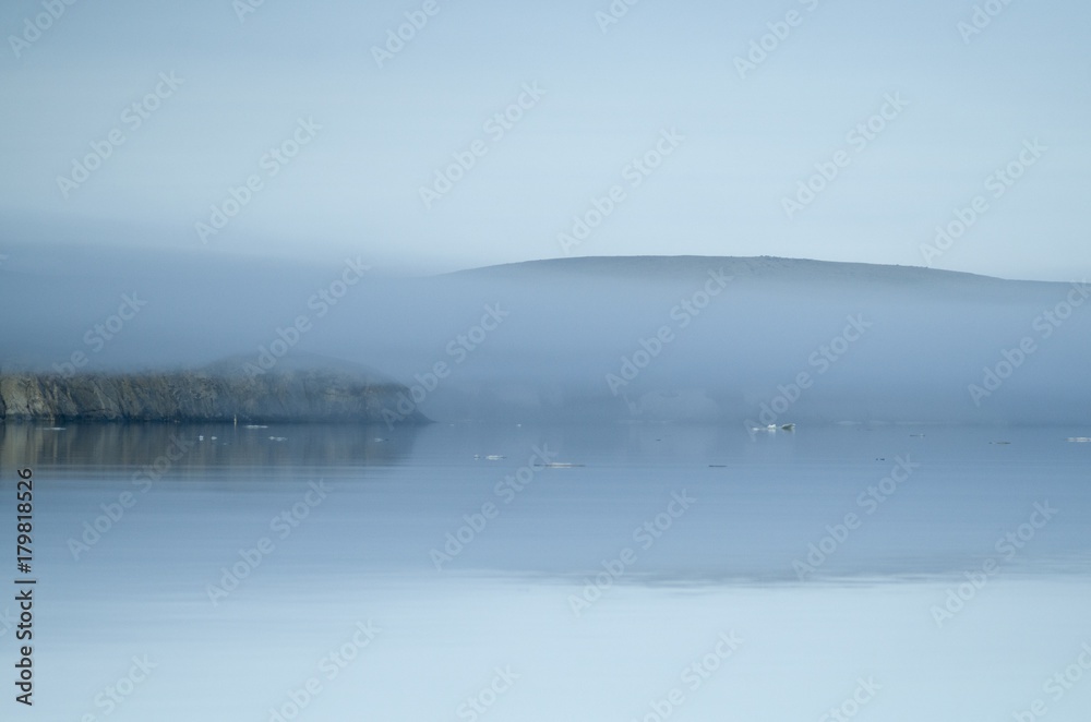 Fototapeta premium The coast of the arctic island in the fog