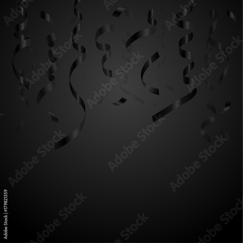 Black serpentine and confetti on a black background.