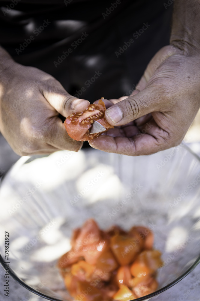 Cutting the tomato for the party